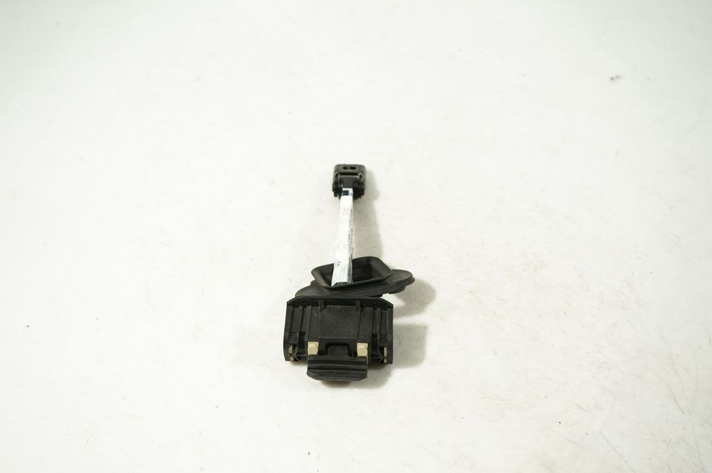 Front door check strap stopper (4)