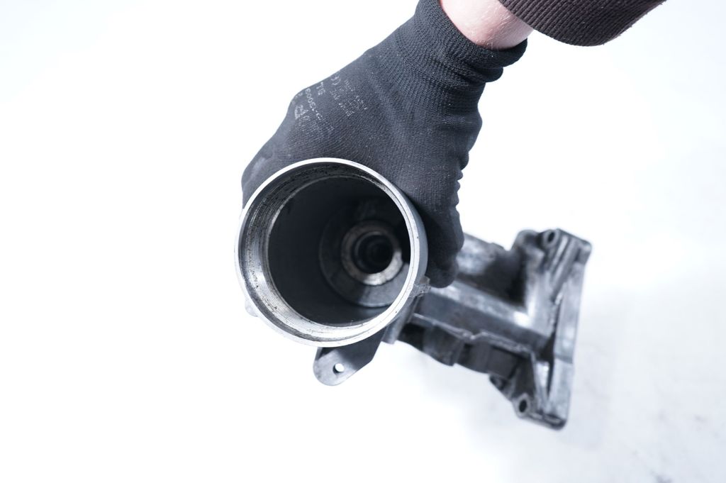 Oil filter mounting bracket (13)