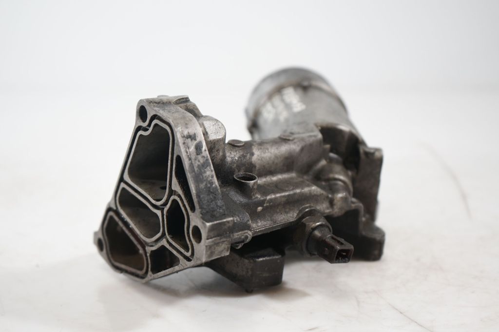 Oil filter mounting bracket (9)